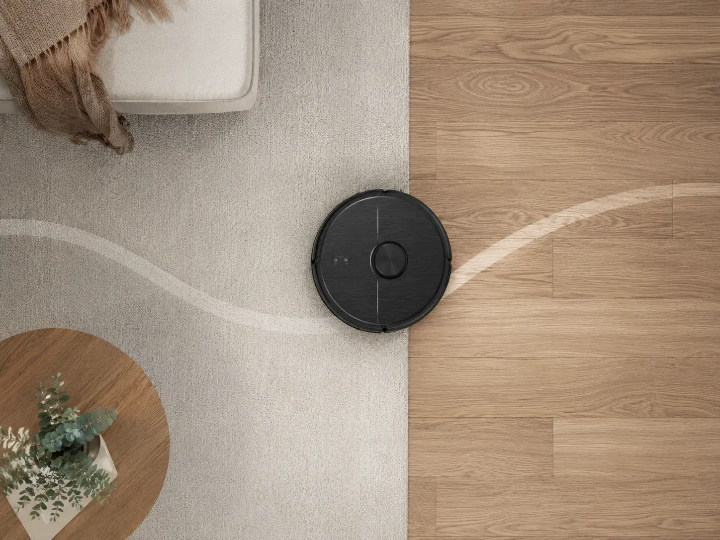 Aspirateur robot vu de dessus nettoyant un sol